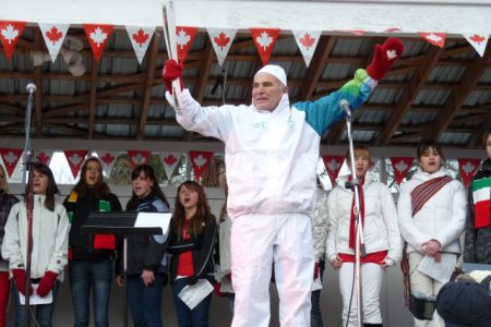 Communities show their pride as they greet the Olympic Torch Relay