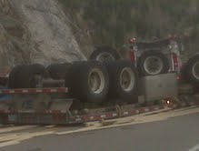 Truck overturns west of Greenwood