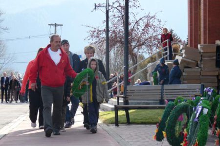 Priede family lays a wreath