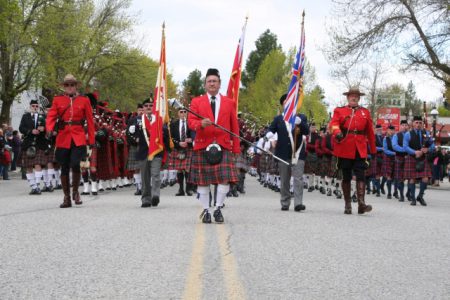 After arriving in downtown Grand Forks, the 150 pipe band members marched back down Market Avenue in unison in an impressive display of colour and sound. Photo Erin Perkins.