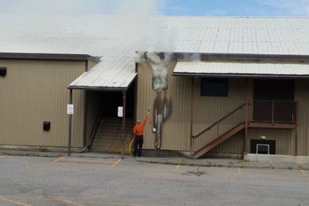 Rec staff and fire fighters quickly contain a fire outside the GF arena