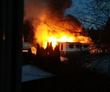 Garage burns down, home saved after early morning fire